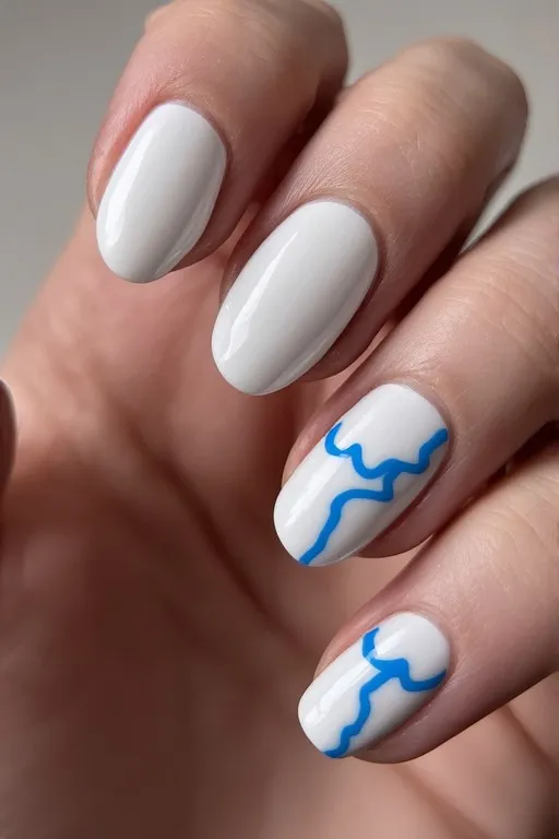  white nails with blue wave accent
