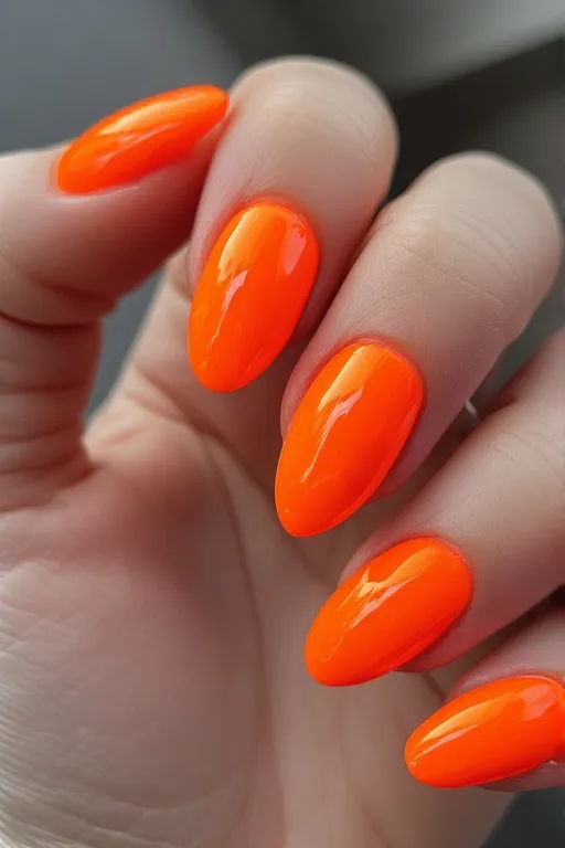 neon orange glossy oval nails