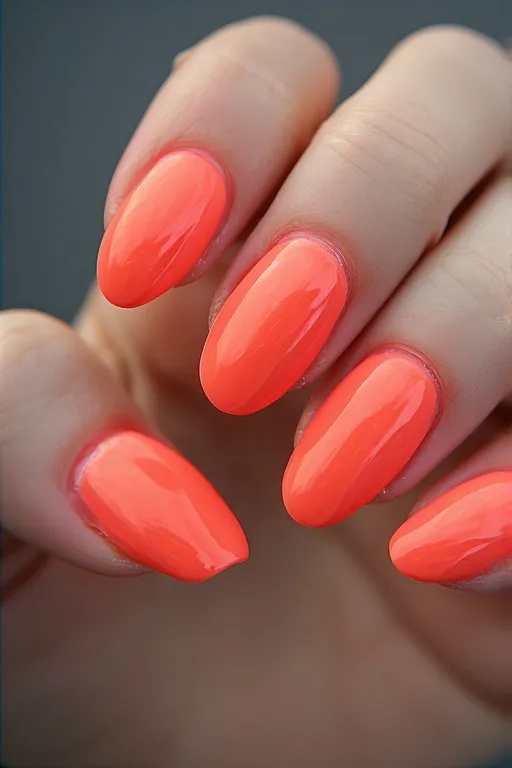 neon coral glossy oval nails
