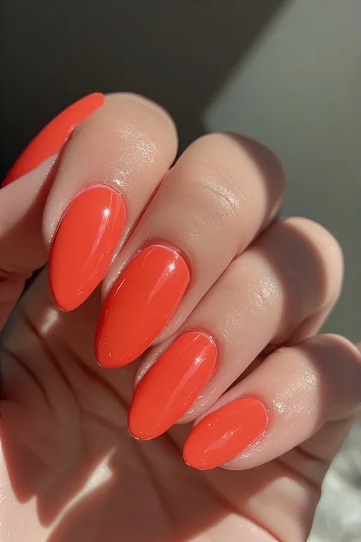 coral glossy almond nails