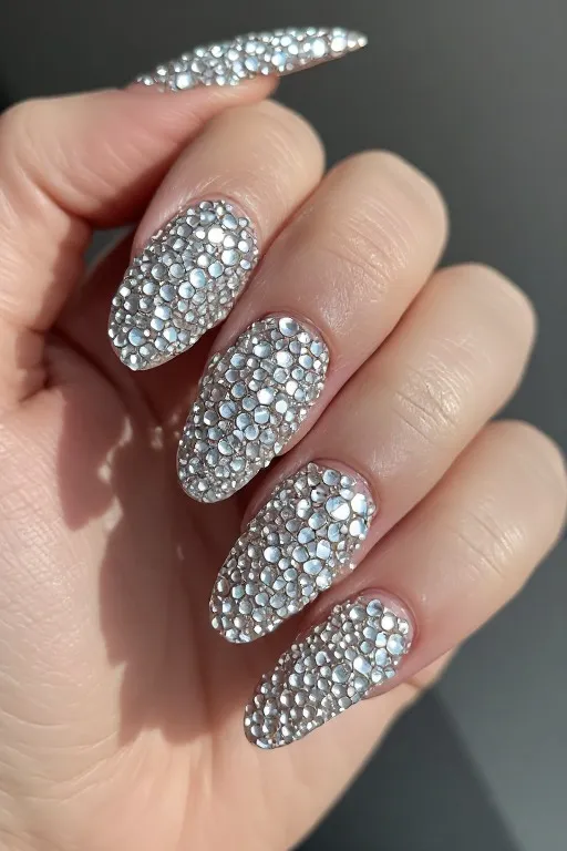 dark teal nails with silver foil accent