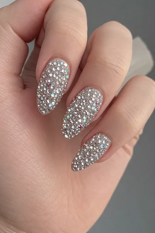 nude nails with rhinestone encrusted tips