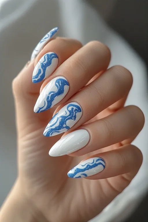 white nails with blue wave accent detail