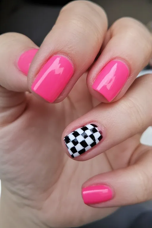  hot pink nails with checkered accent