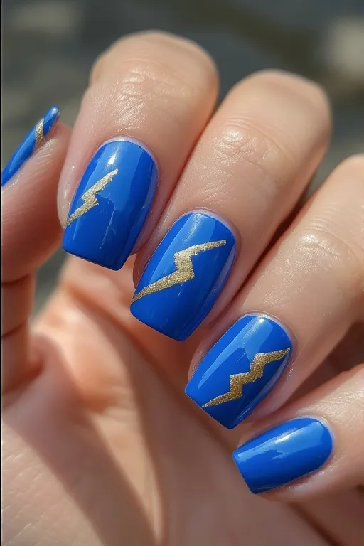  electric blue nails with gold lightning bolt accent