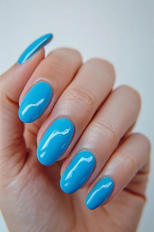 aqua blue glossy oval nails