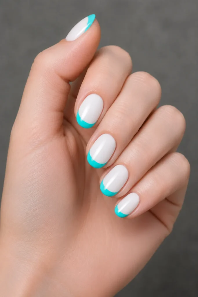 
aqua french tips on white base oval nails